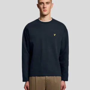 Man wears Raised Jacquard Crew Neck Sweatshirt in Dark Navy